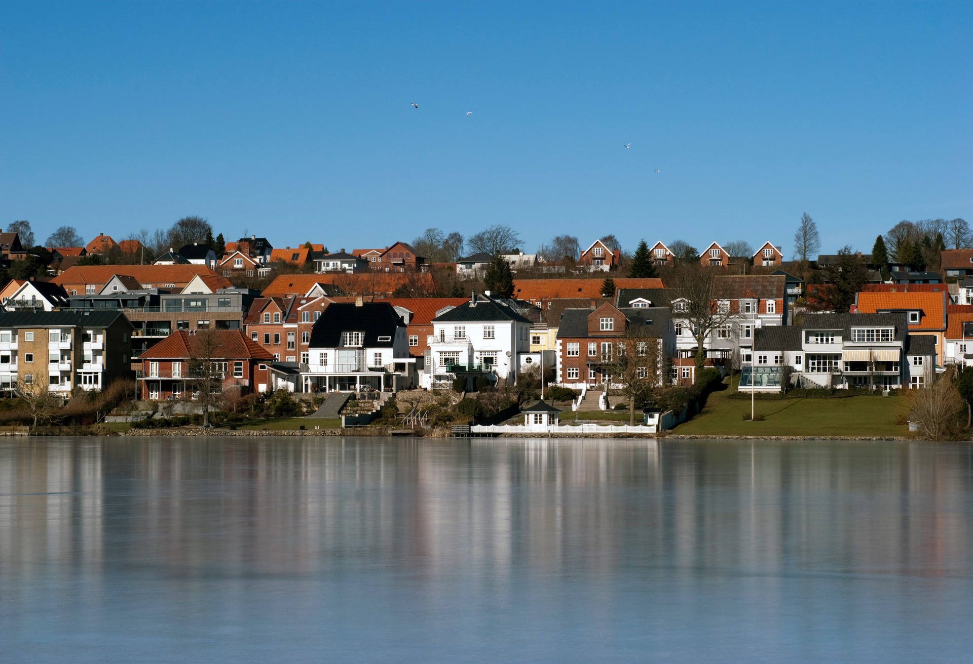 City Skyline. Kolding and lake a clear and cold winter day in Denmark.