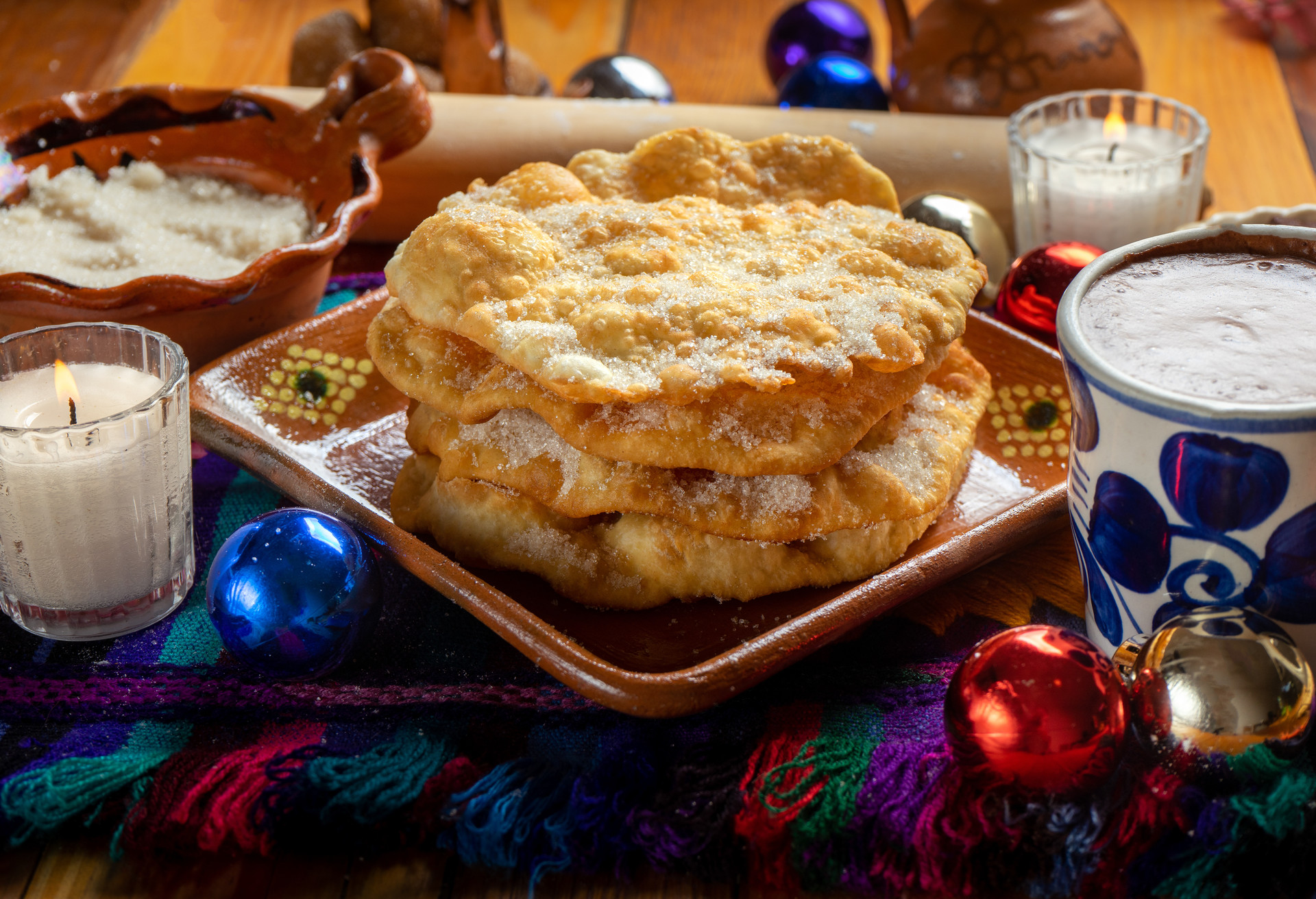 Traditional mexican buñuelos with sugar; Shutterstock ID 1250314618; Purpose: Virtual Christmas Guides; Brand (KAYAK, Momondo, Any): Kayak; Client/Licensee: KAYAK