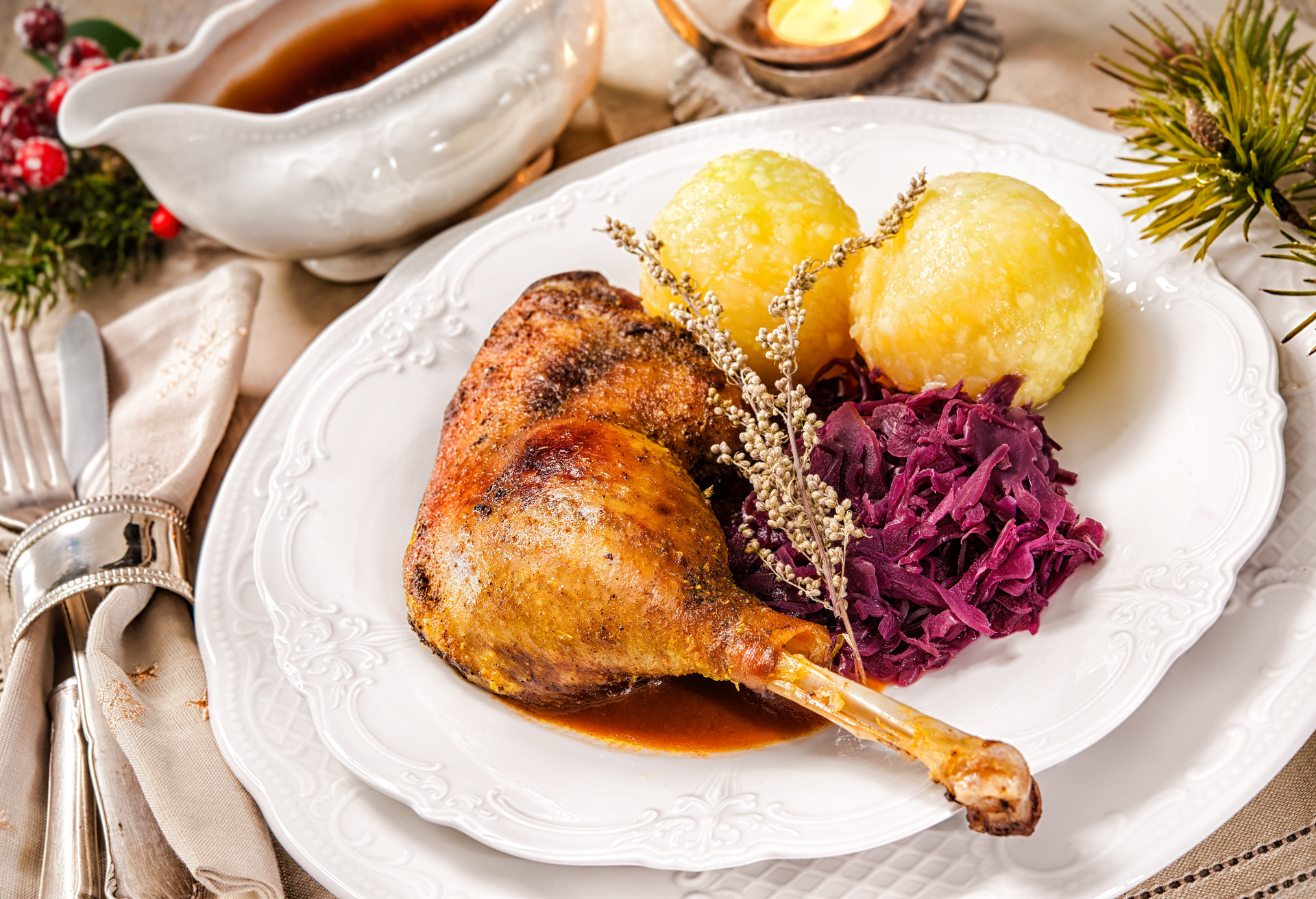Crusty Christmas goose leg with braised red cabbage and dumplings; Shutterstock ID 331604447; Purpose: Virtual Christmas Guides; Brand (KAYAK, Momondo, Any): Kayak; Client/Licensee: KAYAK