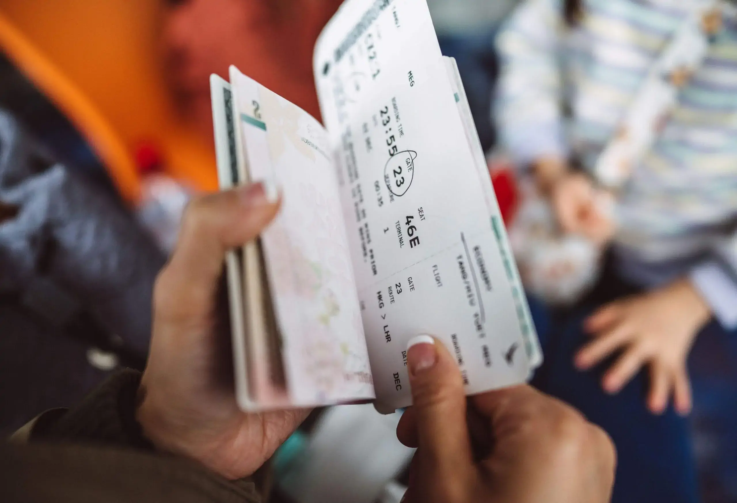 Cropped shot of a female traveller checking her boarding pass and passport at the boarding gate in the airport.