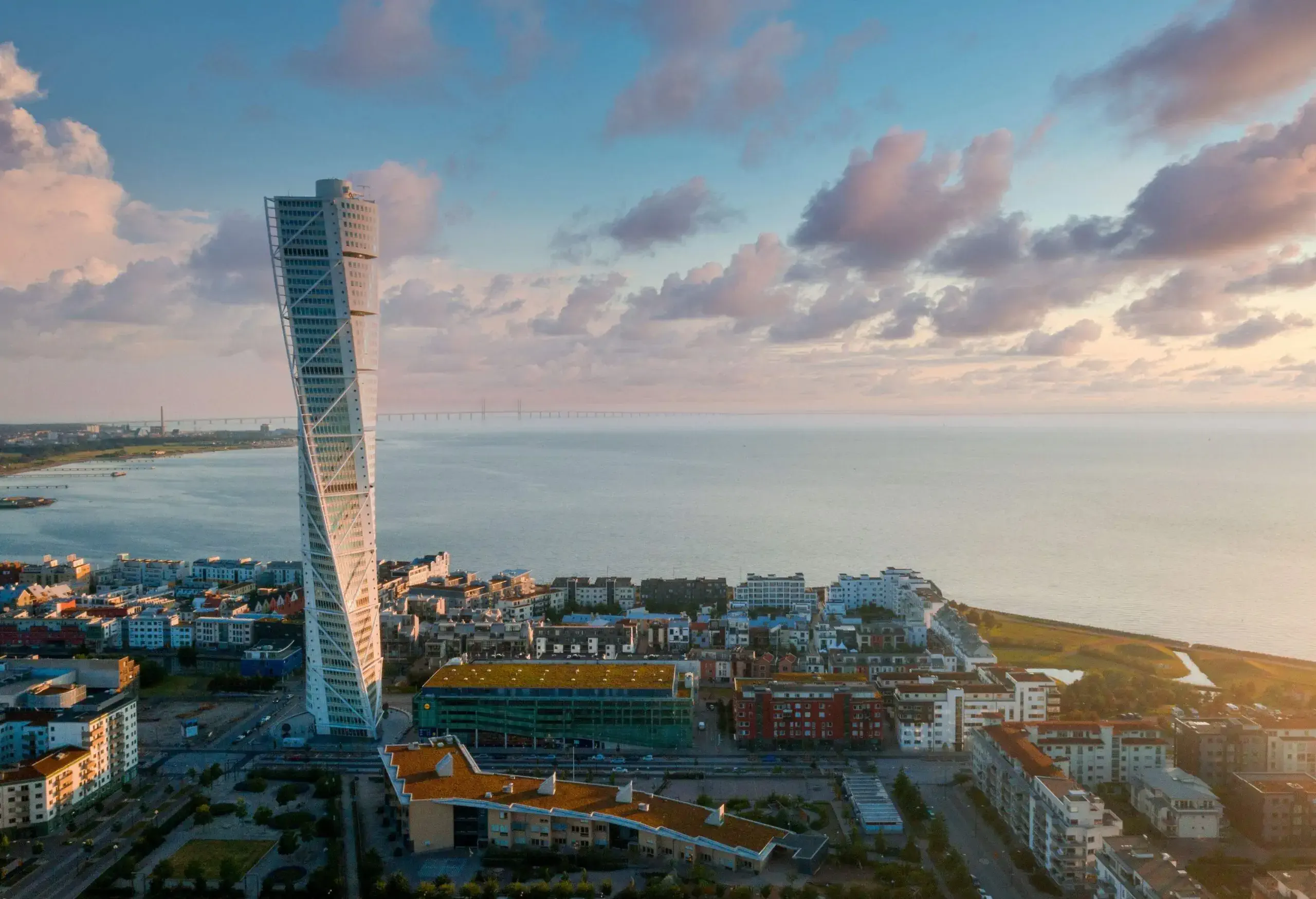 The Turning Torso building looming over the city buildings on the coast.