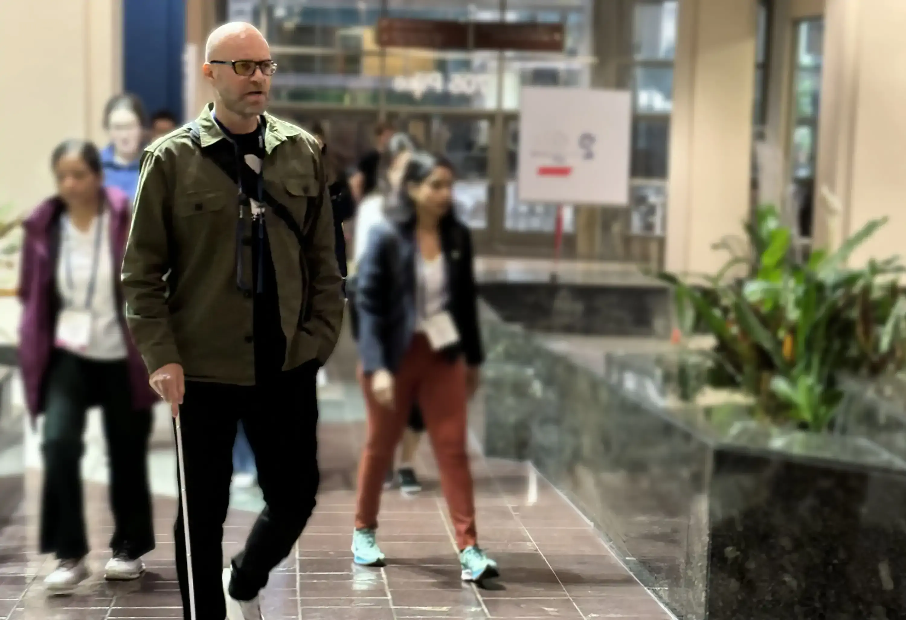 Morten Bonde walking with his cane at the airport
