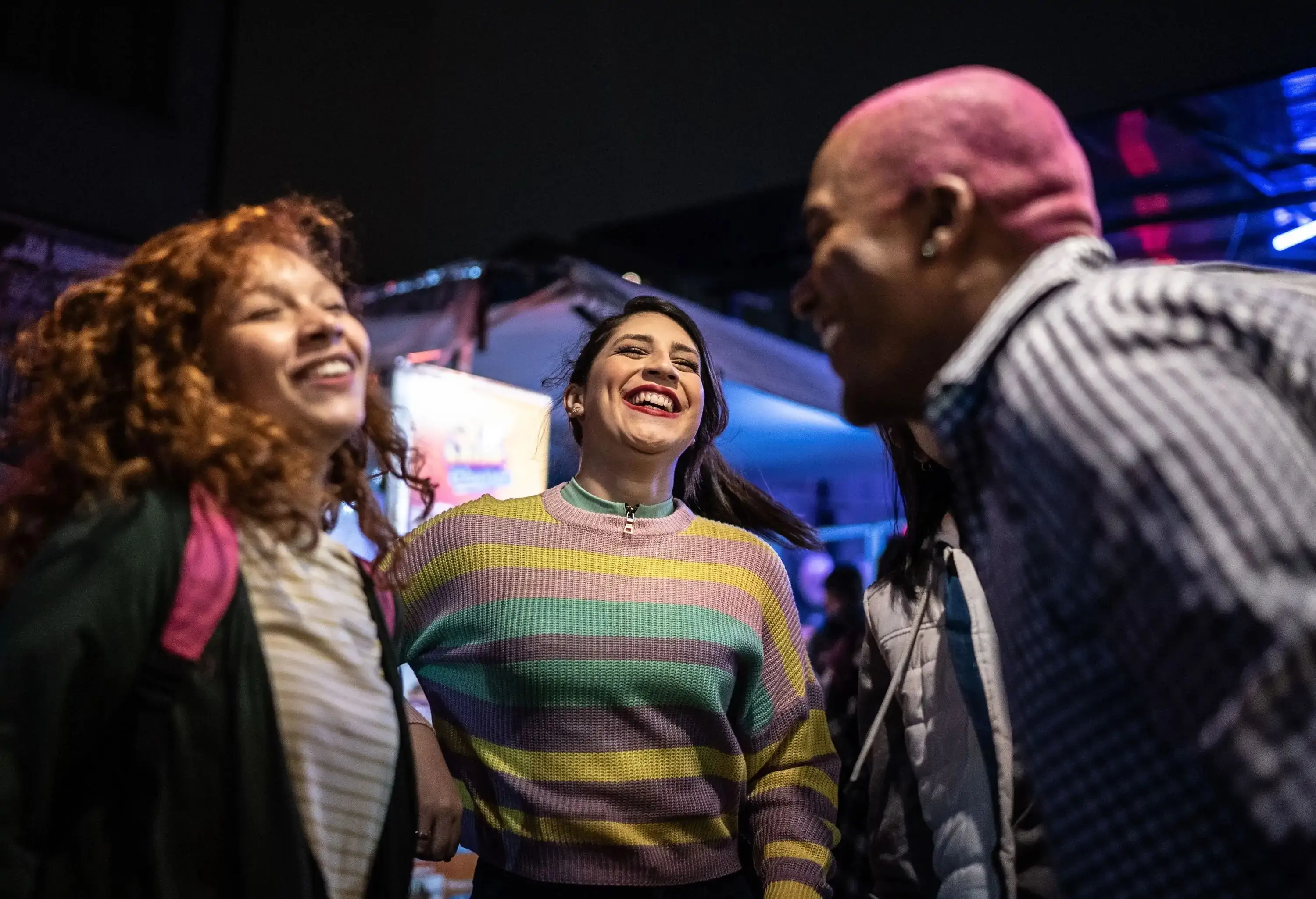 A group of friends have a great time at a nightclub, letting loose and enjoying each other's company on the dance floor.