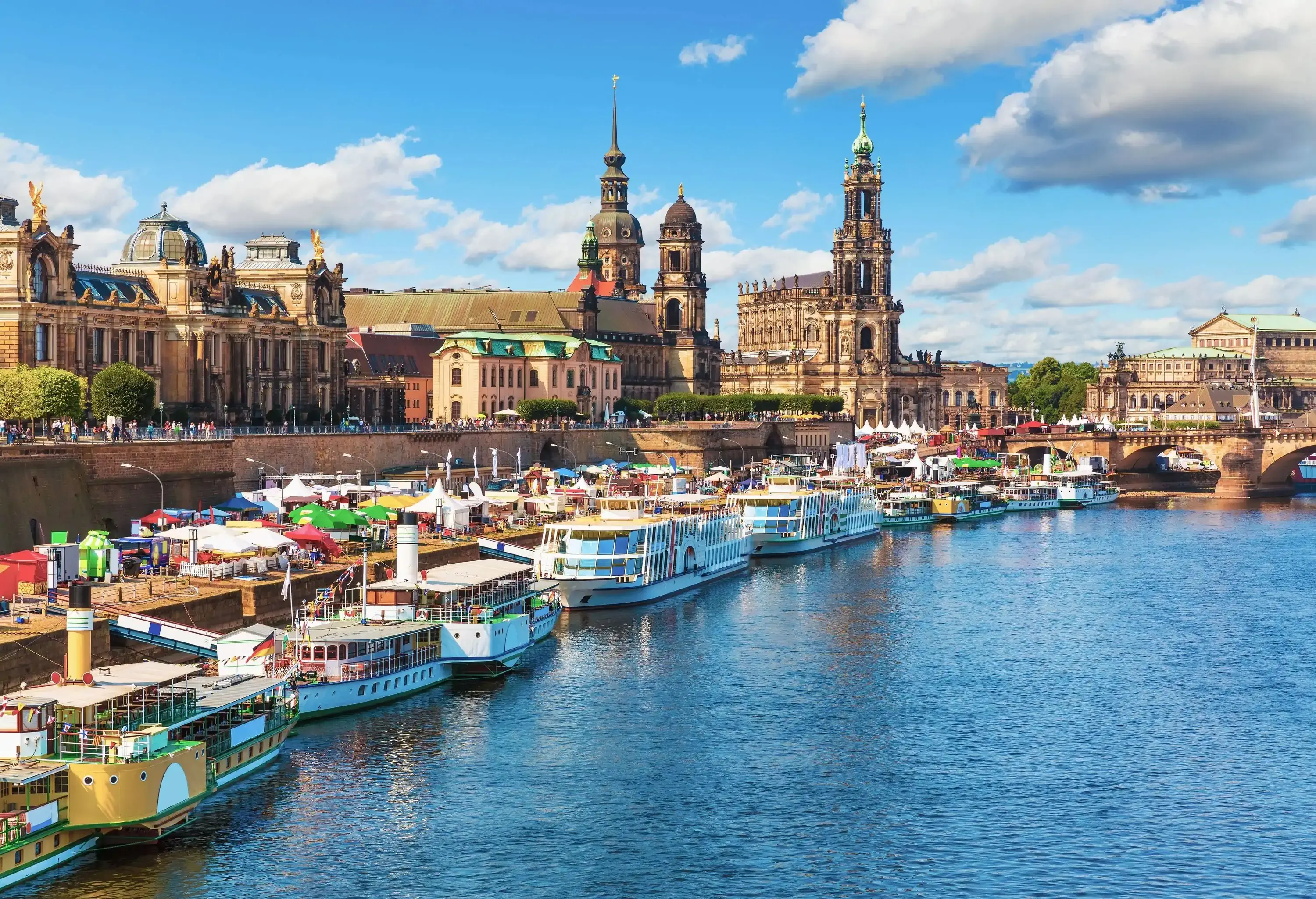 The historic structures of Dresden overlooking the busy port along River Elbe.