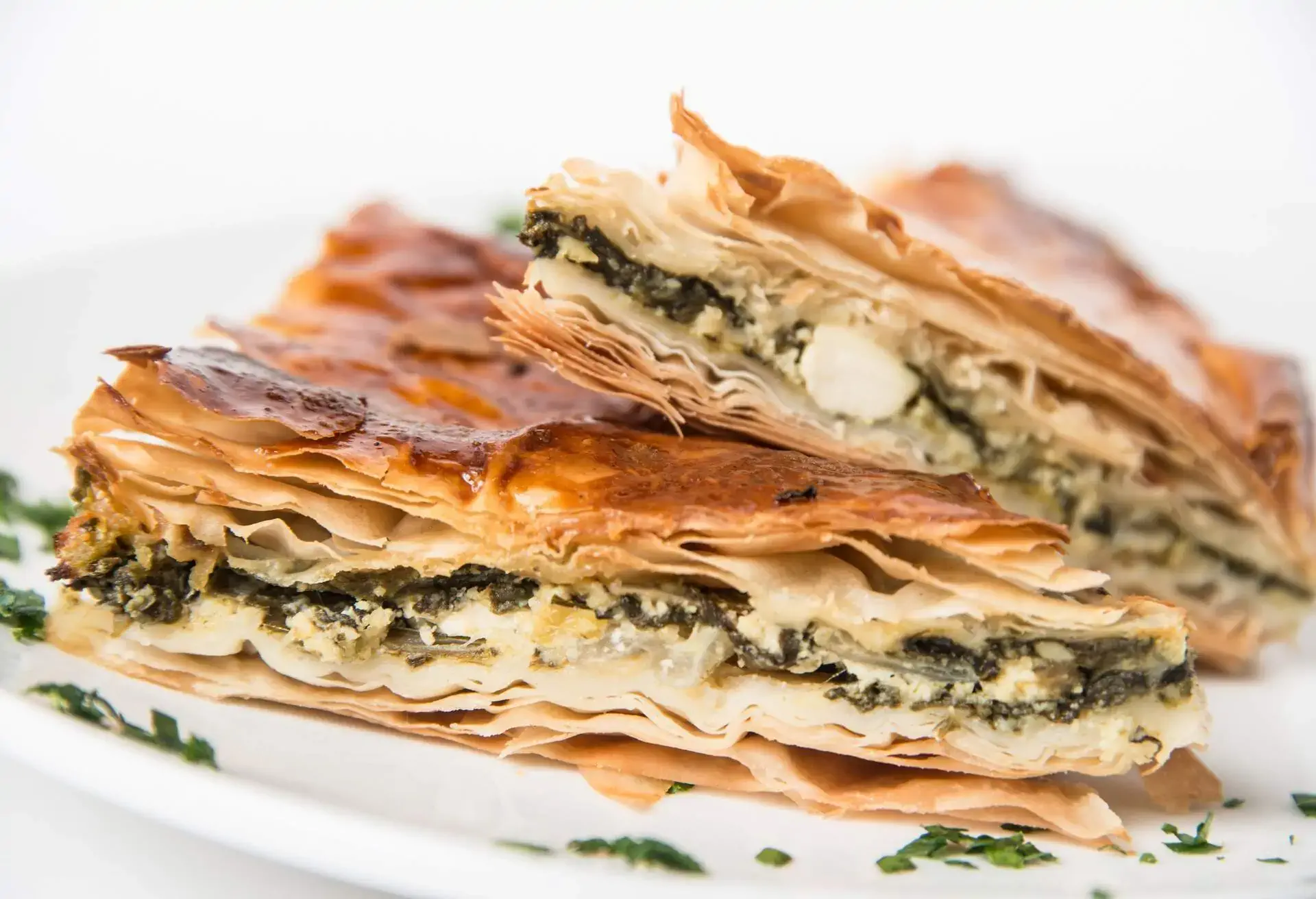 Spanakopita on a white plate
