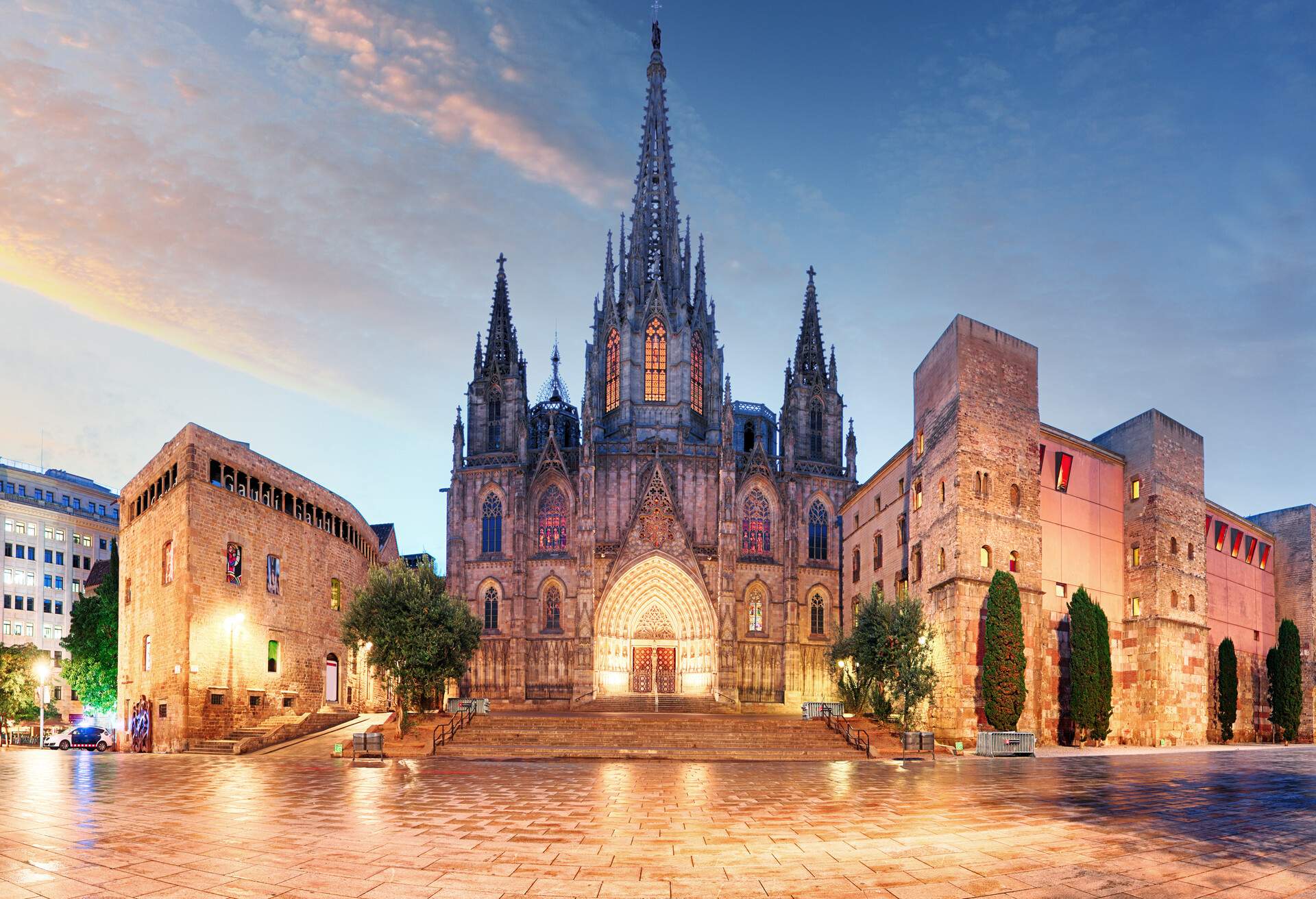 Barcelona Cathedral is a Gothic-style cathedral that features an arched entry, big stained-glass windows, exquisitely-designed spire, and two sharp pinnacles.