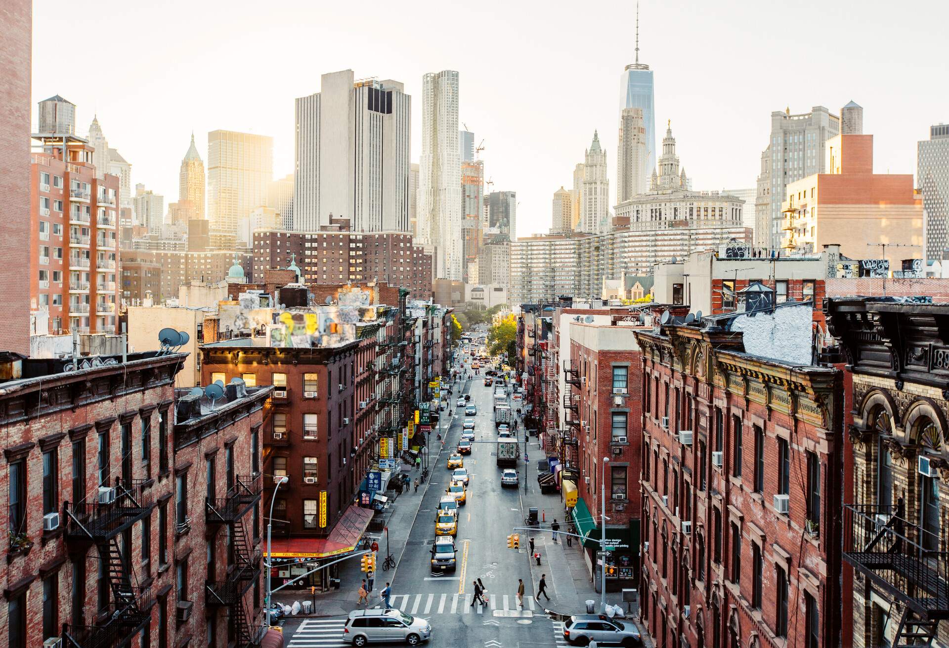 Aerial perspective, a bustling street is surrounded by classic buildings, with modern buildings appearing in the background.