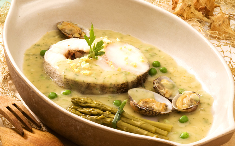 Spanish cuisine. Hake Basque style. Served in a ceramic plate. Merluza en salsa verde.; Shutterstock ID 45887755
