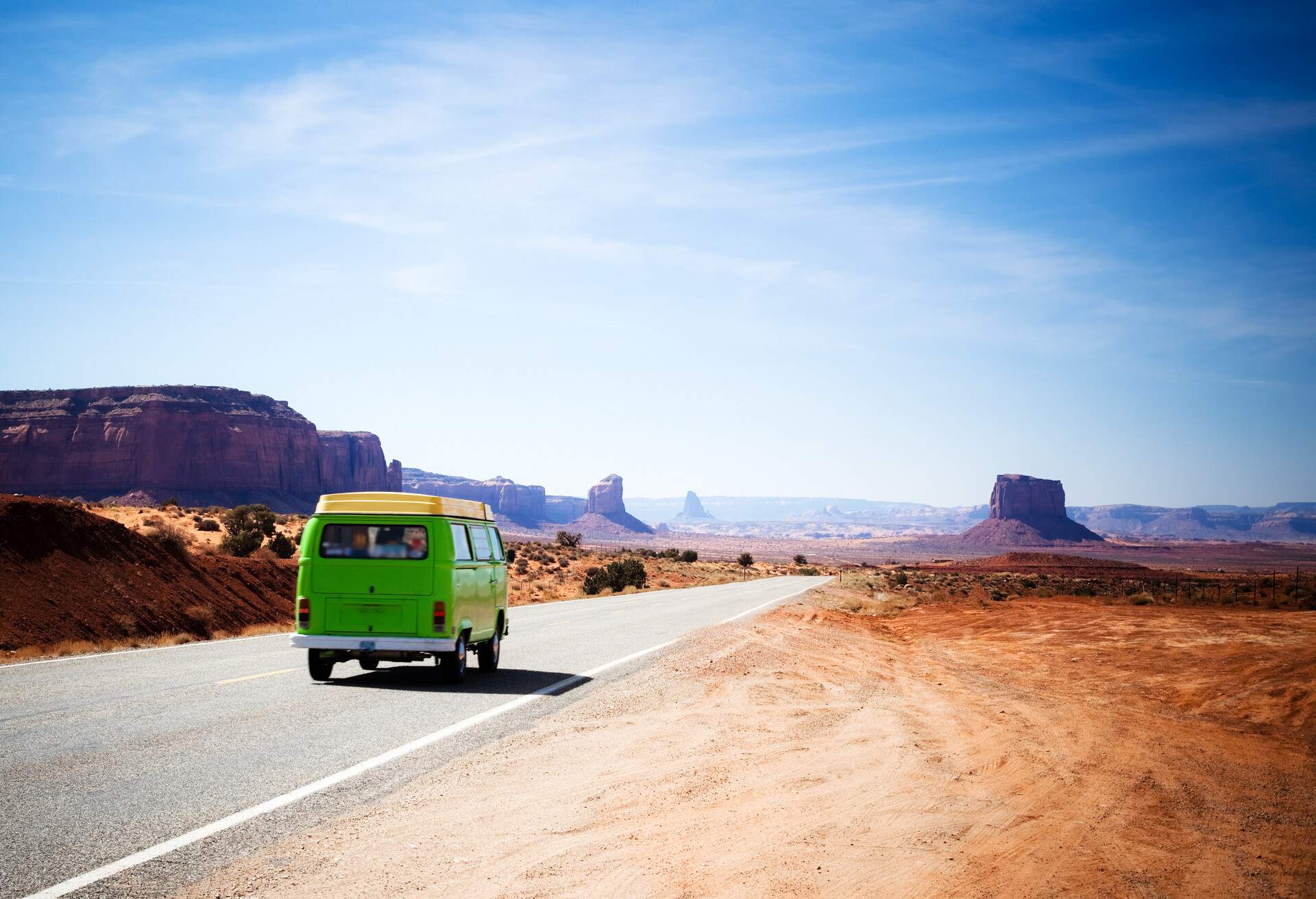 DEST_USA_ARIZONA_UTAH-Green van driving on the Highway 163 in the Monument Valley between Utah and Arizona-GettyImages-161842456