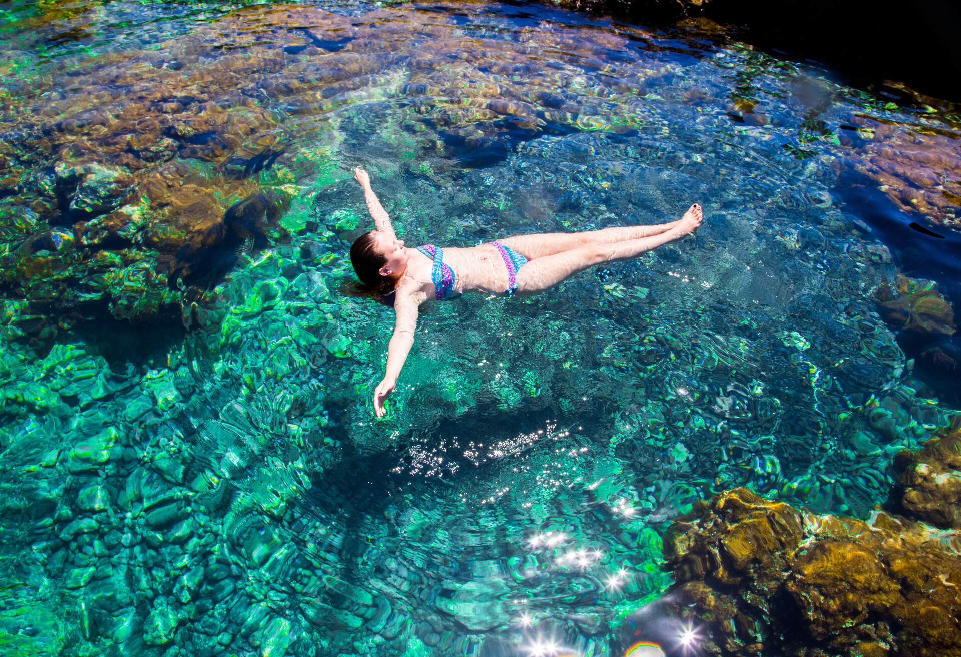 DEST_SPAIN_TENERIFE_NATURAL_POOL_PEOPLE_WOMAN_SWIMMING_FLOATING_GettyImages-682244750