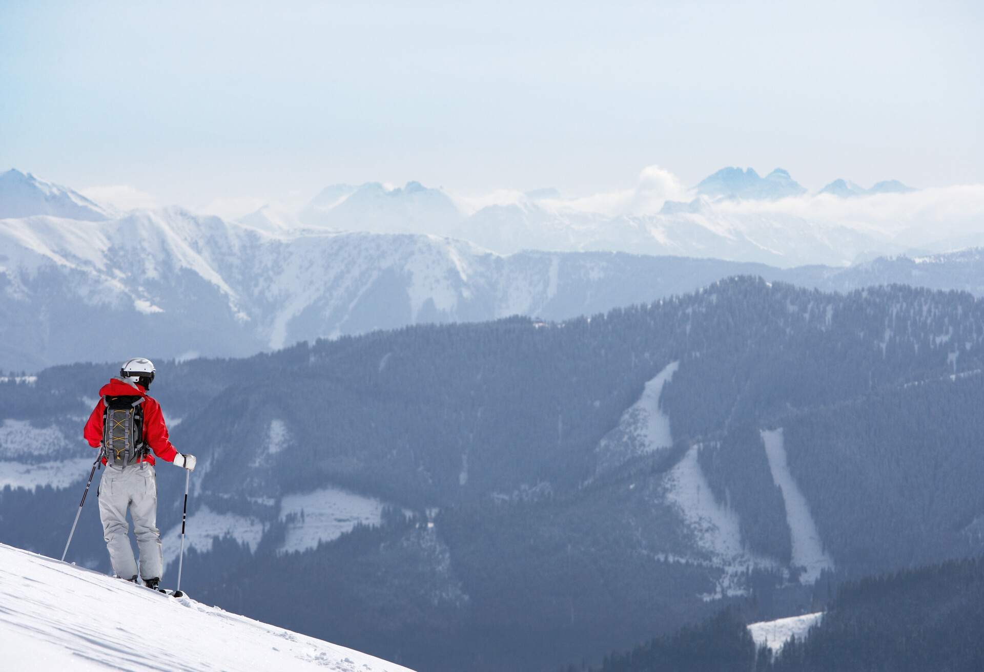 Male skier standing on slope; Shutterstock ID 659849656; Purpose: ; Brand (KAYAK, Momondo, Any):