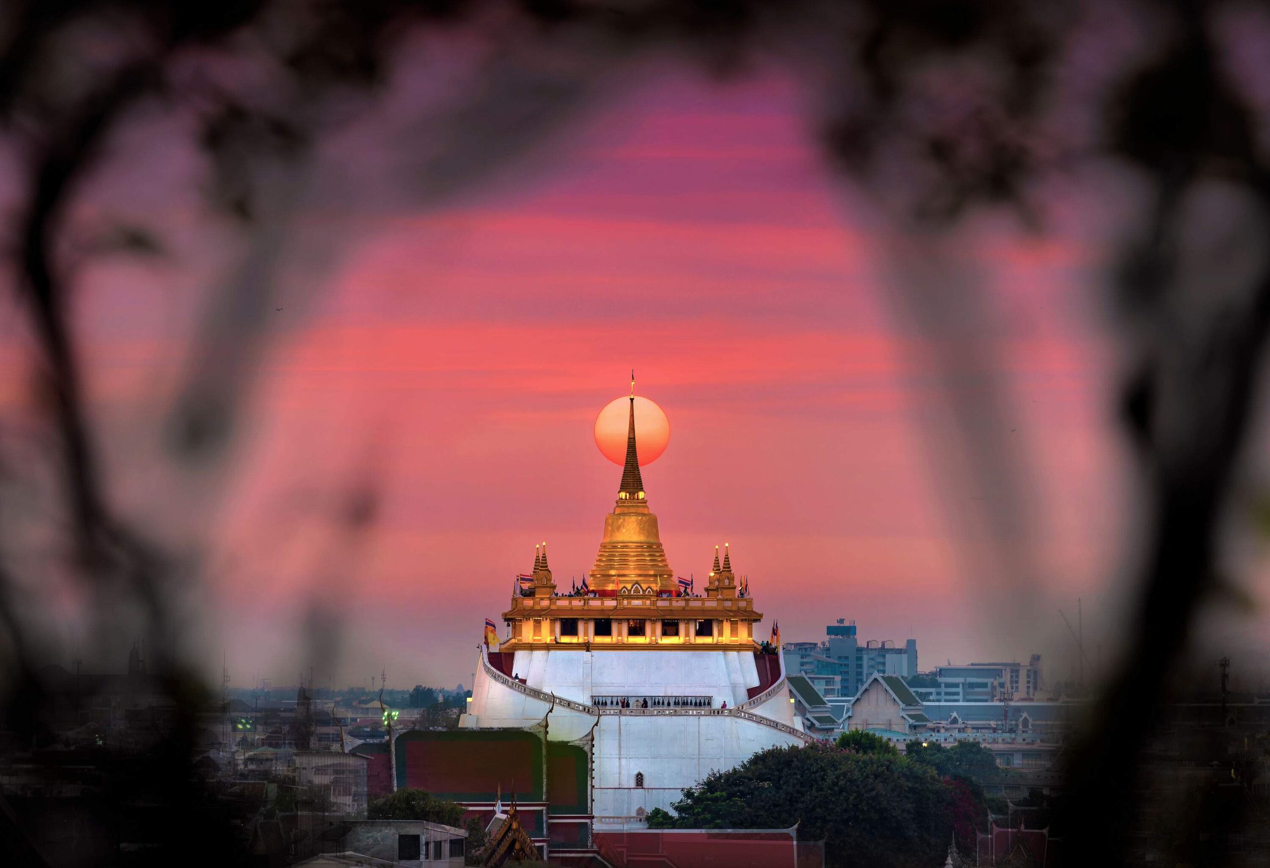 Wat Saket is a temple located on a man-made hill with a golden bell-shaped chedi with a towering spire.
