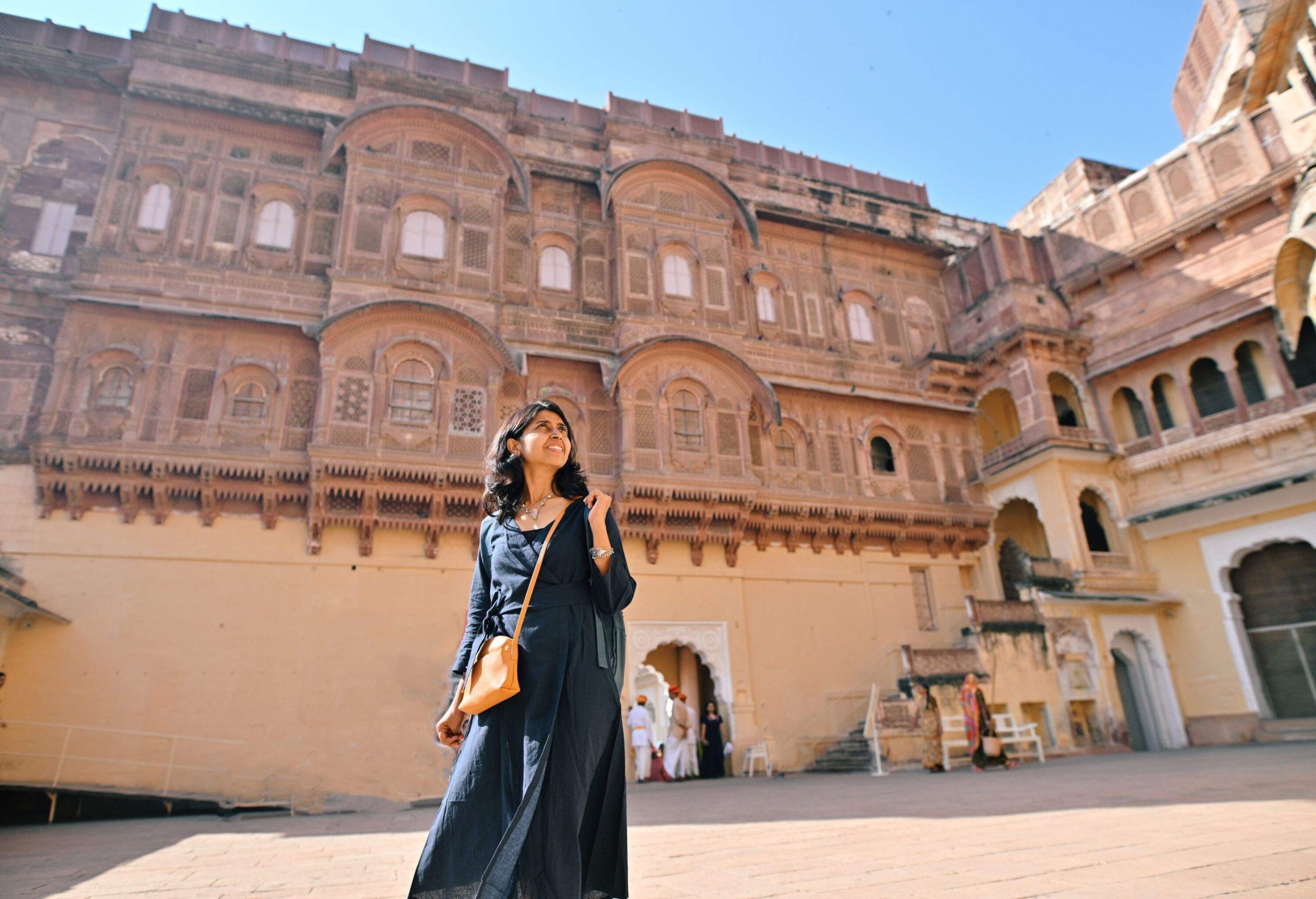 Mid Adult tourist Woman exploring one of the largest fort Meharangarh (Mehran Fort), located in Jodhpur, Rajasthan, is one of the largest forts in India