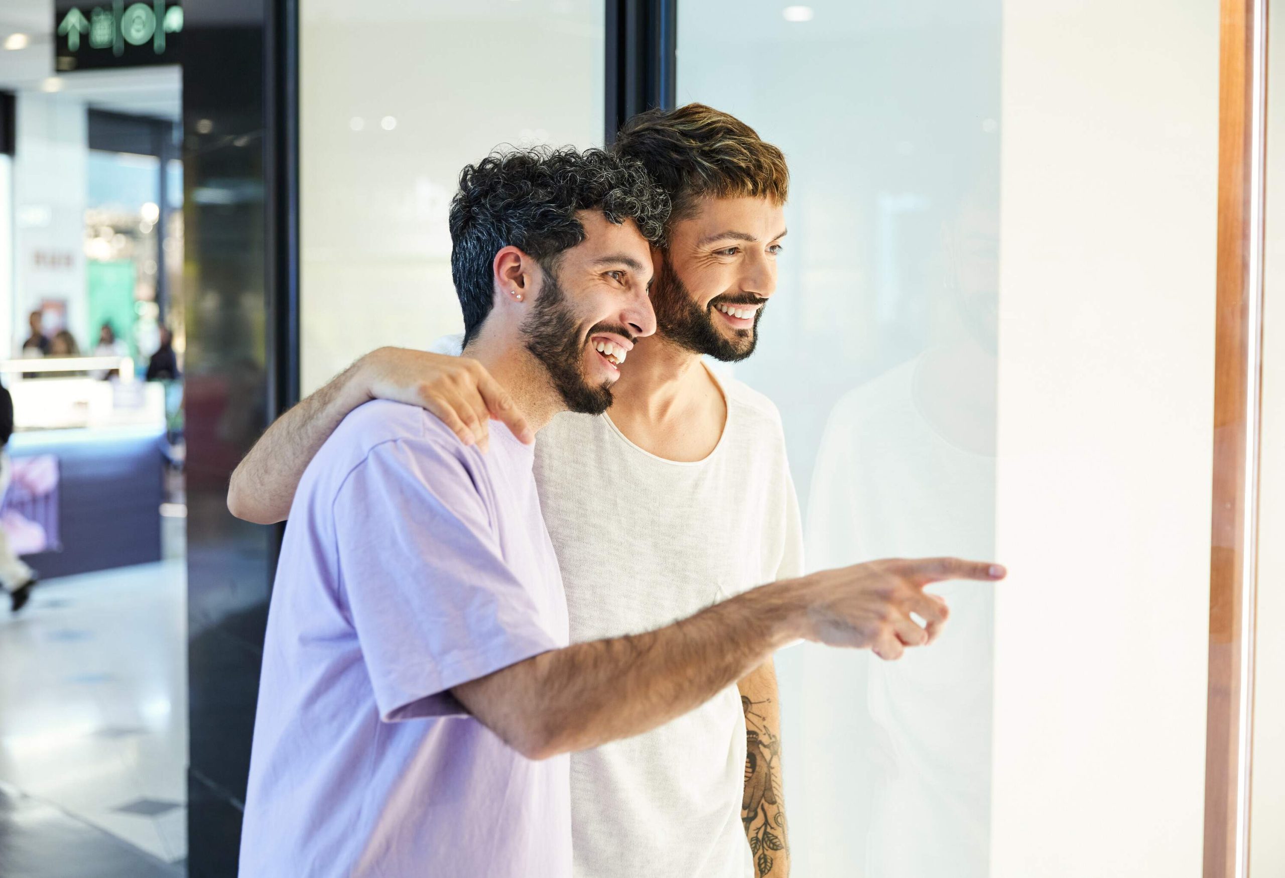 theme_people_men_couple_gay_shopping_mall_window_gettyimages-1487572856-copy