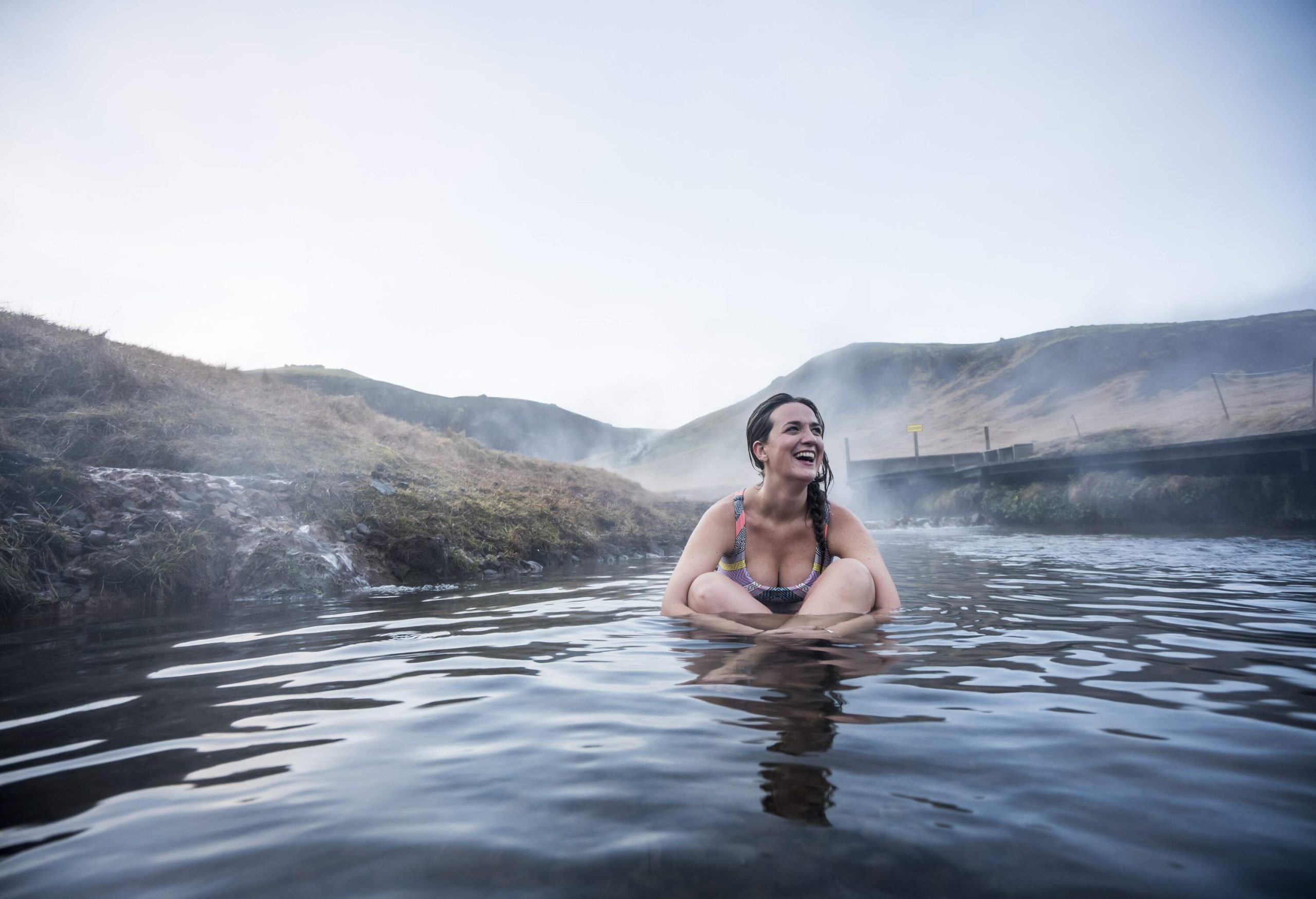 dest_iceland_people_woman_hot_spring_lagoon_gettyimages-1146669985_universal_within-usage-period_92319