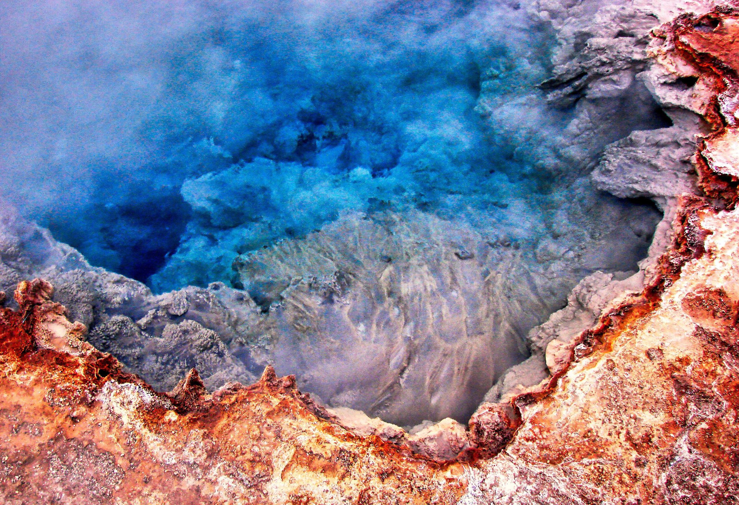 A mesmerising geyser with crystalline turquoise steamy water.