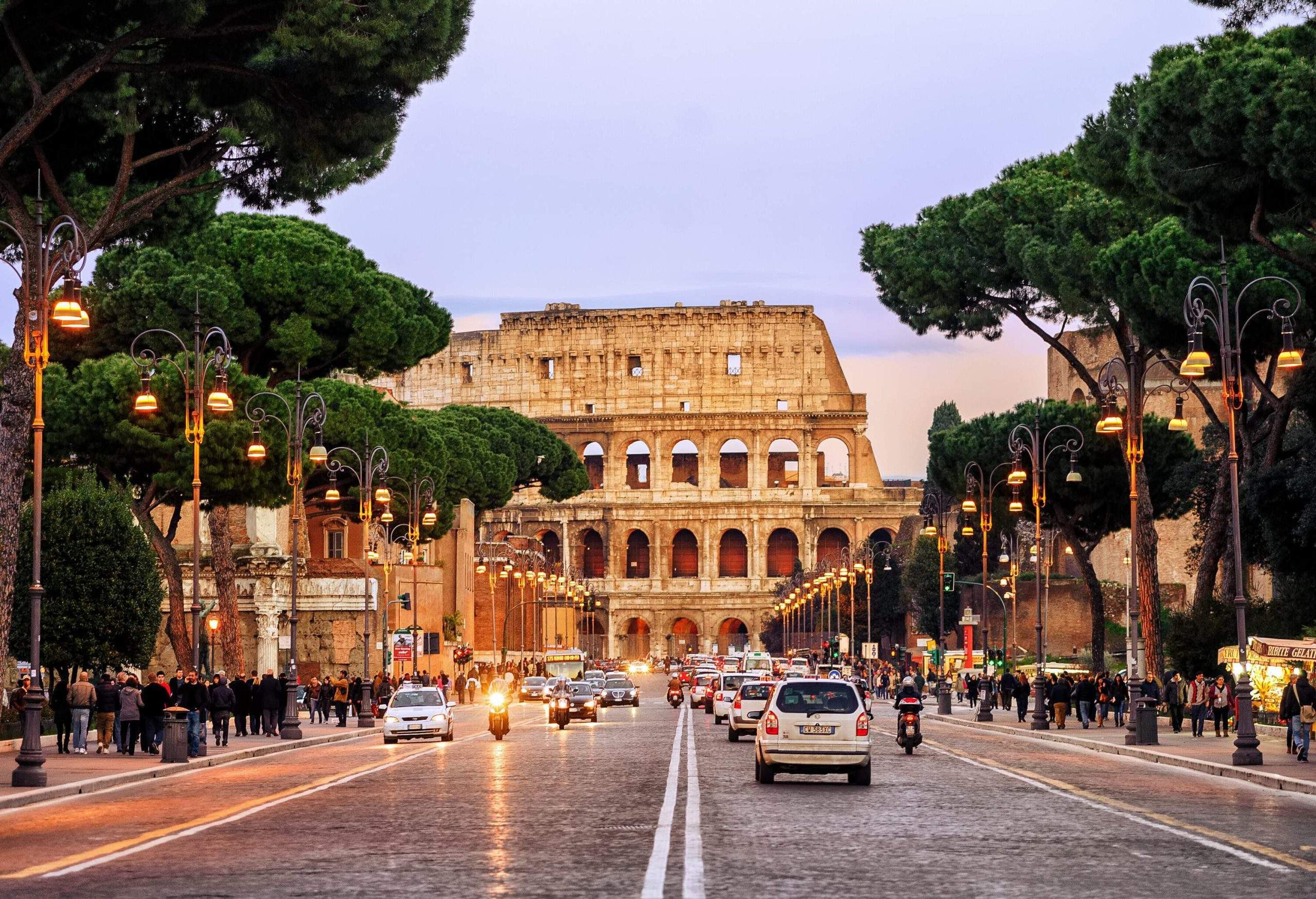 dest_italy_rome_colosseum_theme_car_driving_travel-gettyimages-684002336-scaled