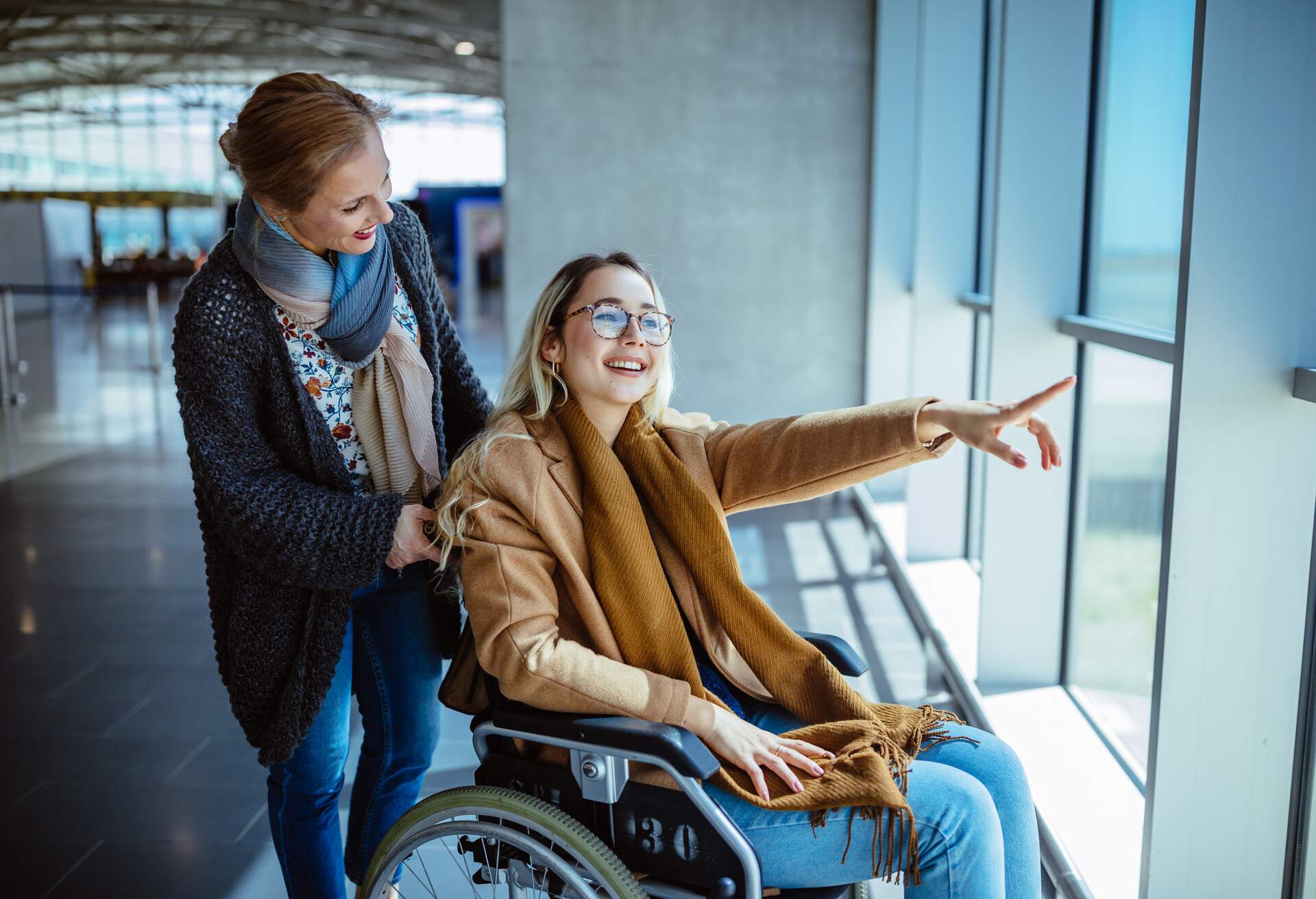 theme_people_family_airport_wheelchair_gettyimages-959523414-1