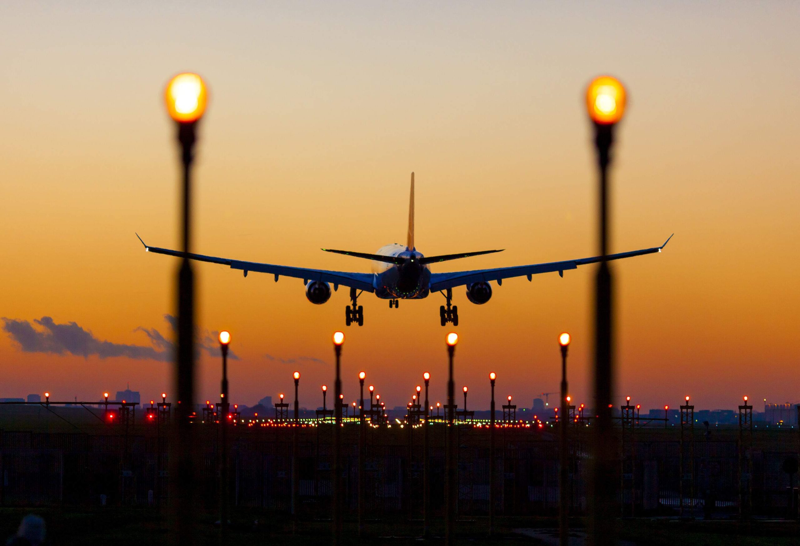 Captivating sunset landing with rows of mesmerising lights illuminating the runway.