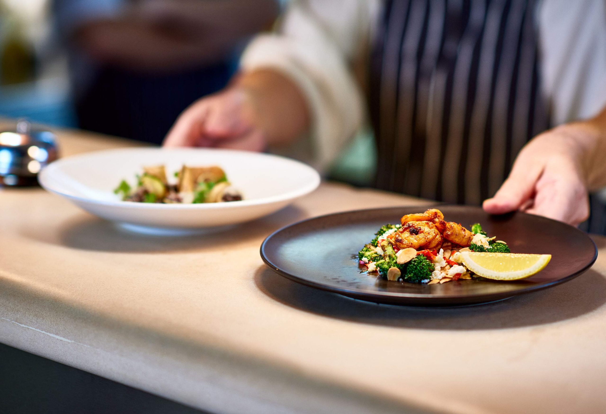 An enticing meal, meticulously prepared and beautifully presented, is placed on a counter.