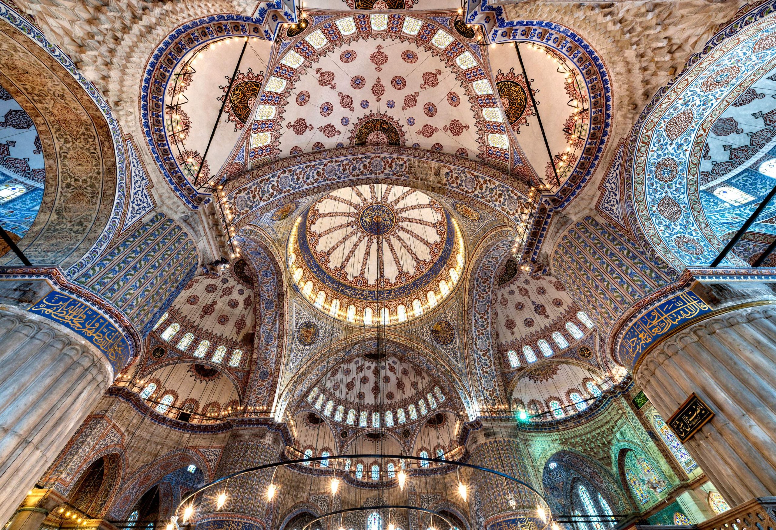 Intricate details of a dome ceiling decorated with uniquely patterned ceramic tiles.