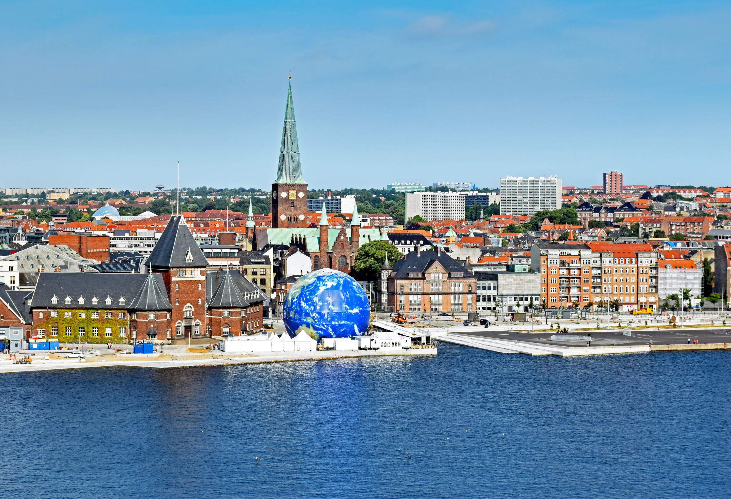 The remarkable city of Aarhus filled with iconic structures seen from across the harbour.