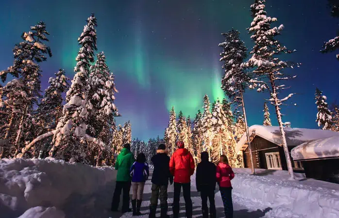Beautiful picture of massive multicolored green vibrant Aurora Borealis, Aurora Polaris, also know as Northern Lights in the night sky over winter Lapland landscape, Norway, Scandinavia