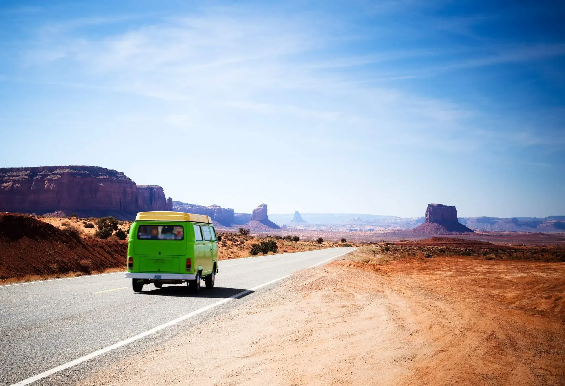 DEST_USA_ARIZONA_UTAH-Green van driving on the Highway 163 in the Monument Valley between Utah and Arizona-GettyImages-161842456