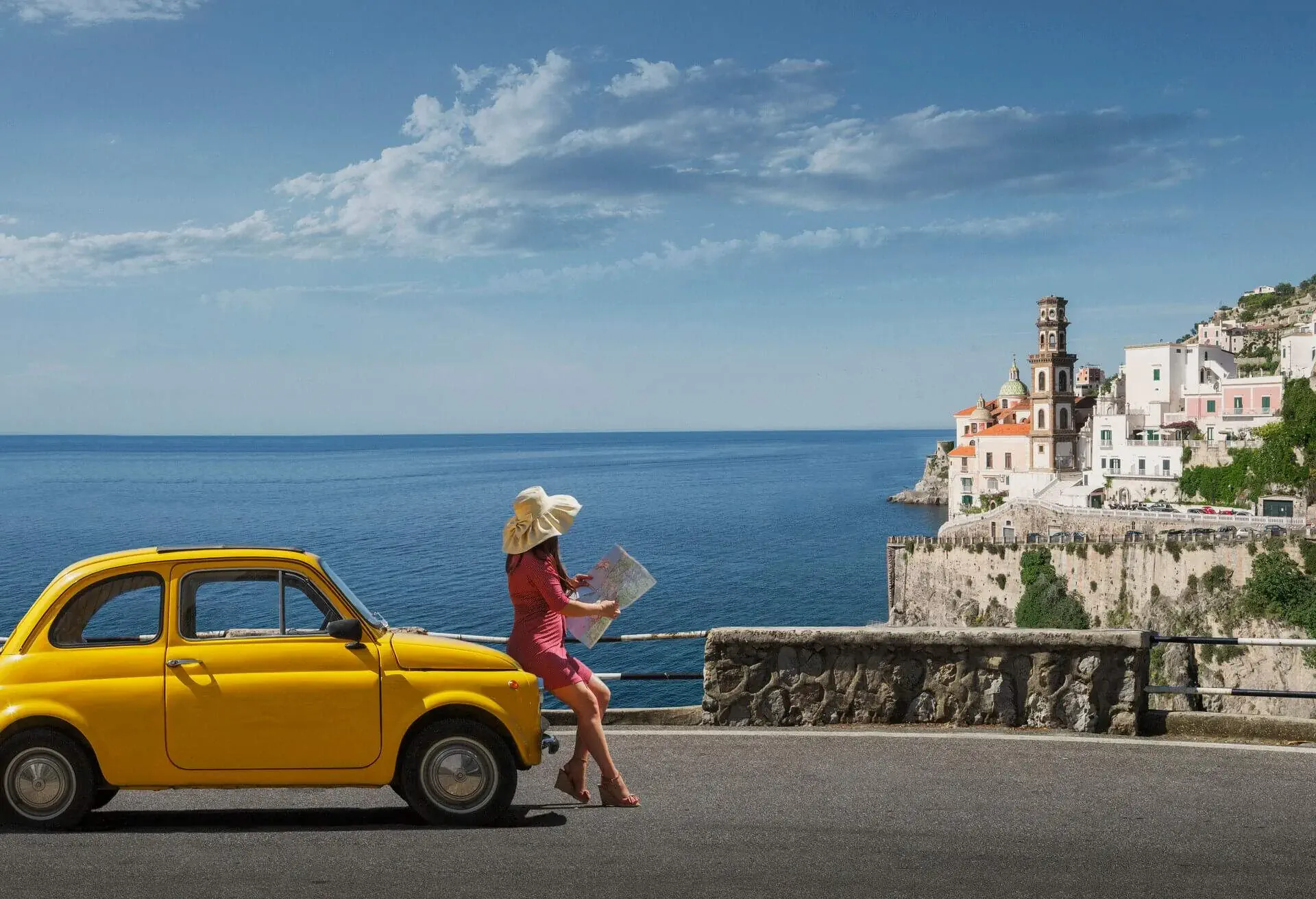 tourist sitting on yellow car