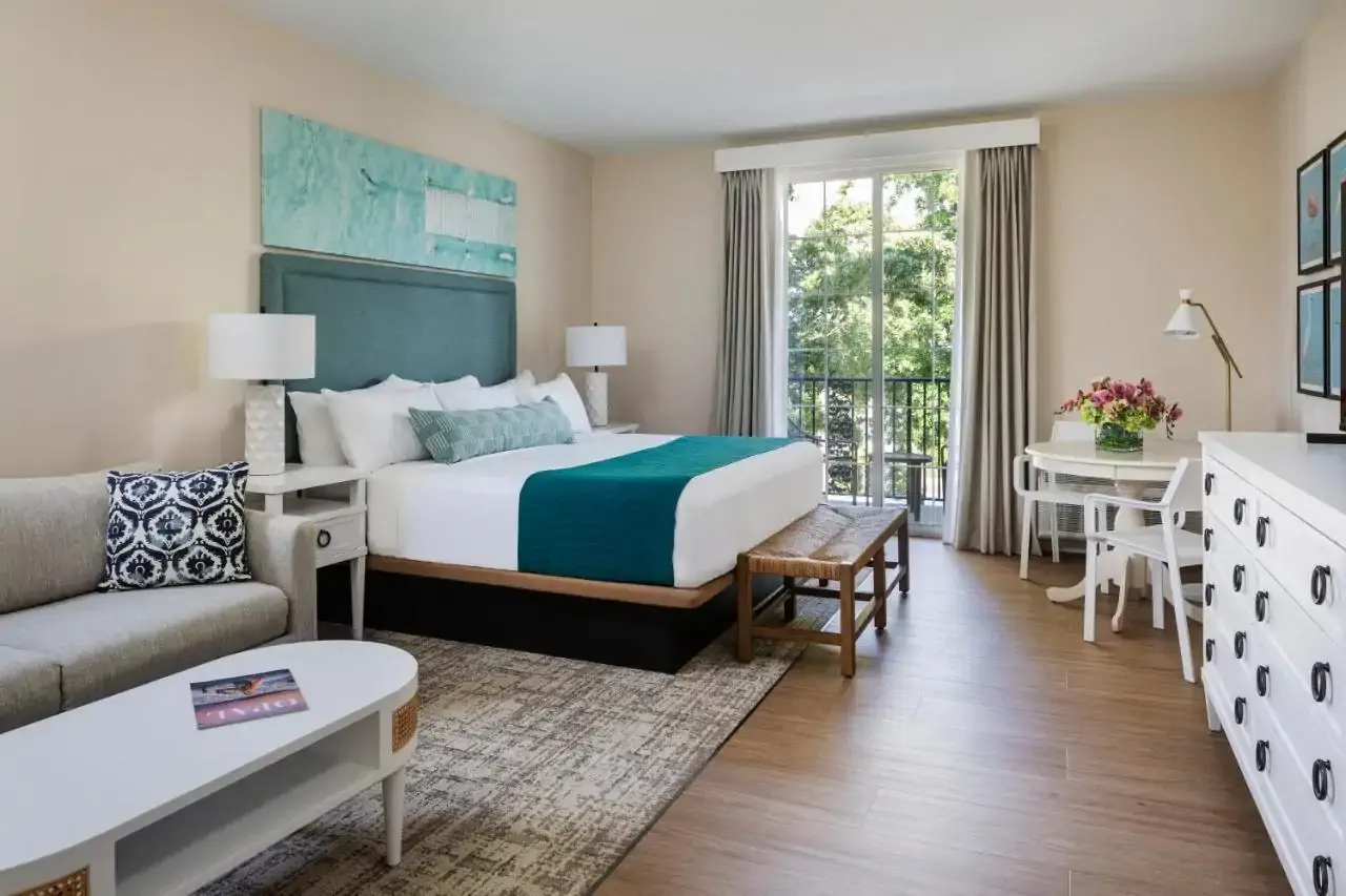 Hotel room decorated in neutral tones and modern country style