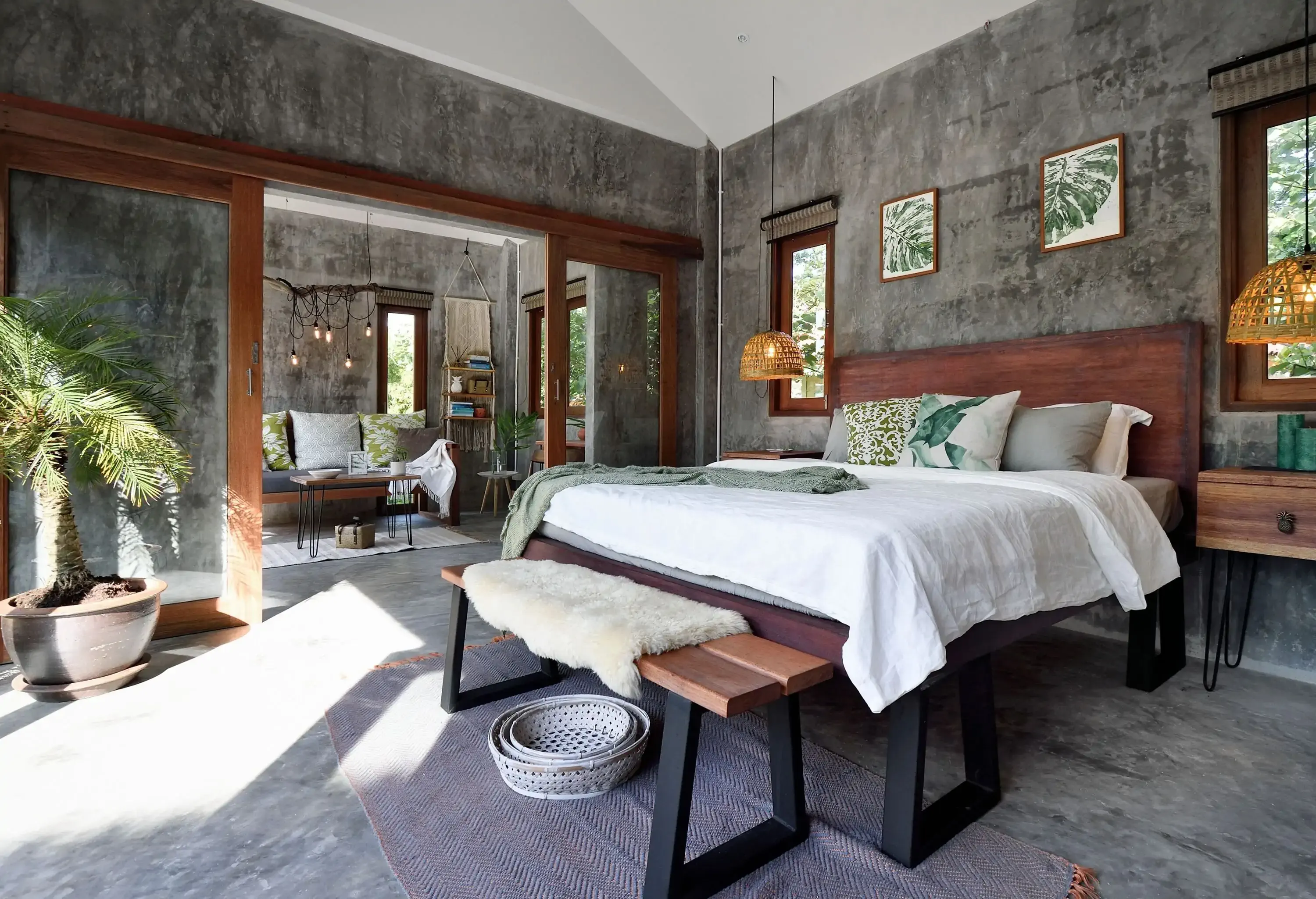 The bedroom features unpainted walls adorned with a nature motif, bringing a touch of the outdoors inside.