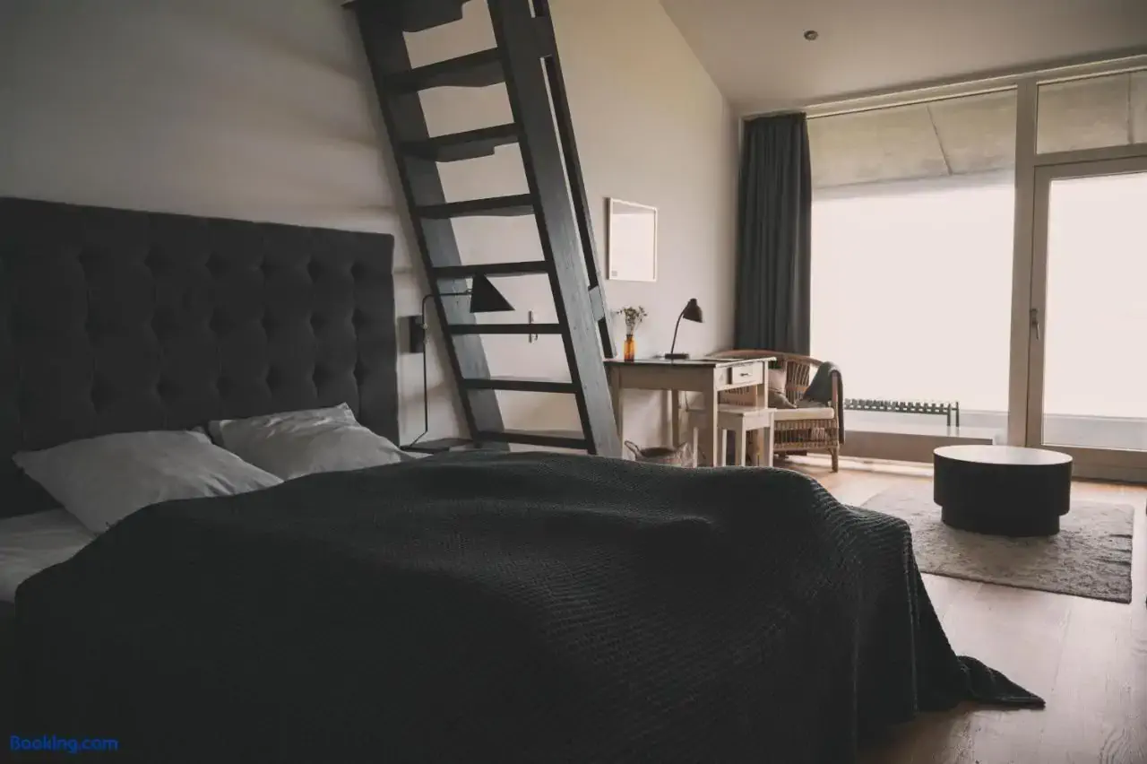 Hotel room with chair and large window