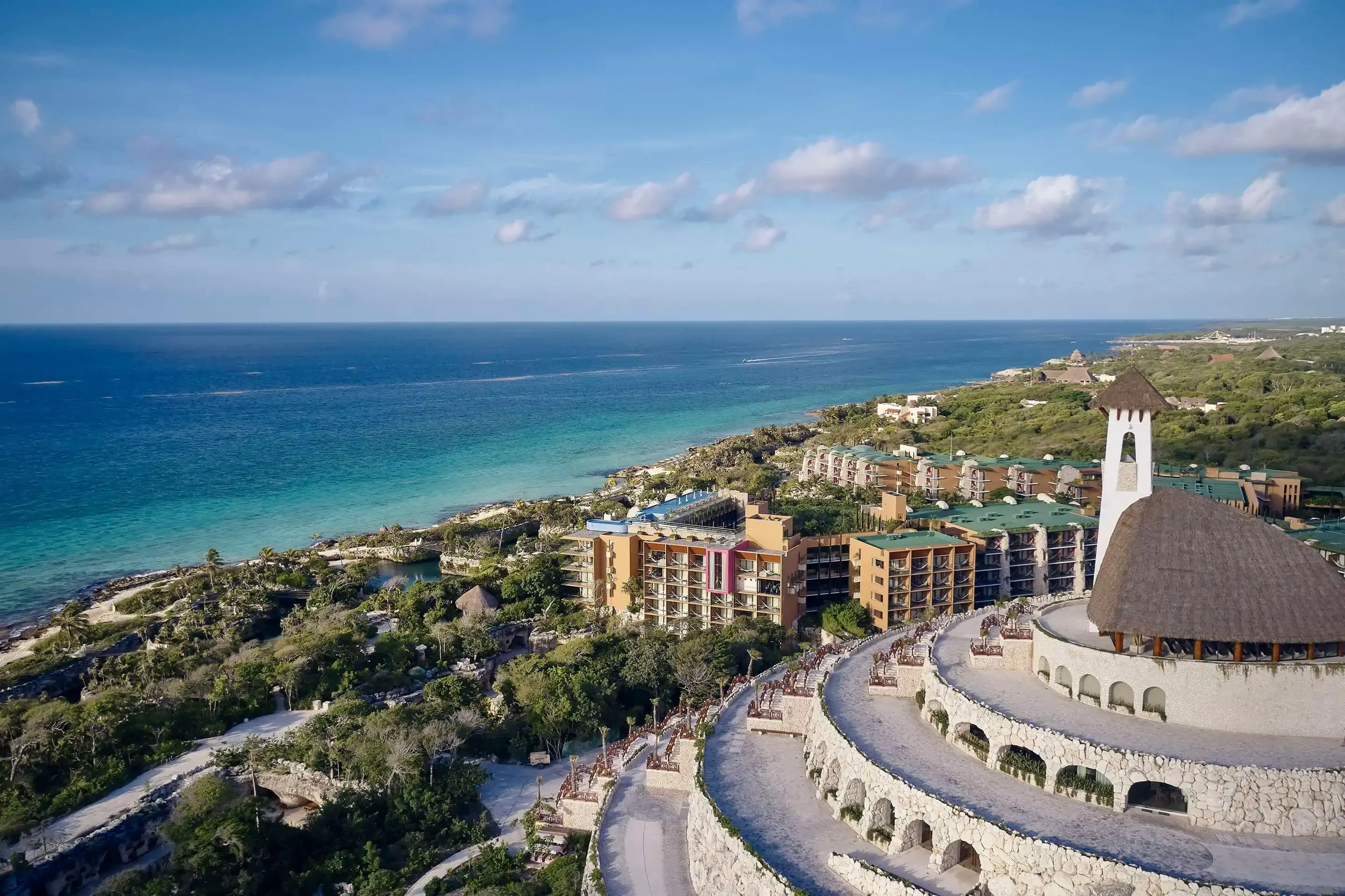 Aerial view of large hotel resort built in ancient mayan style by the sea