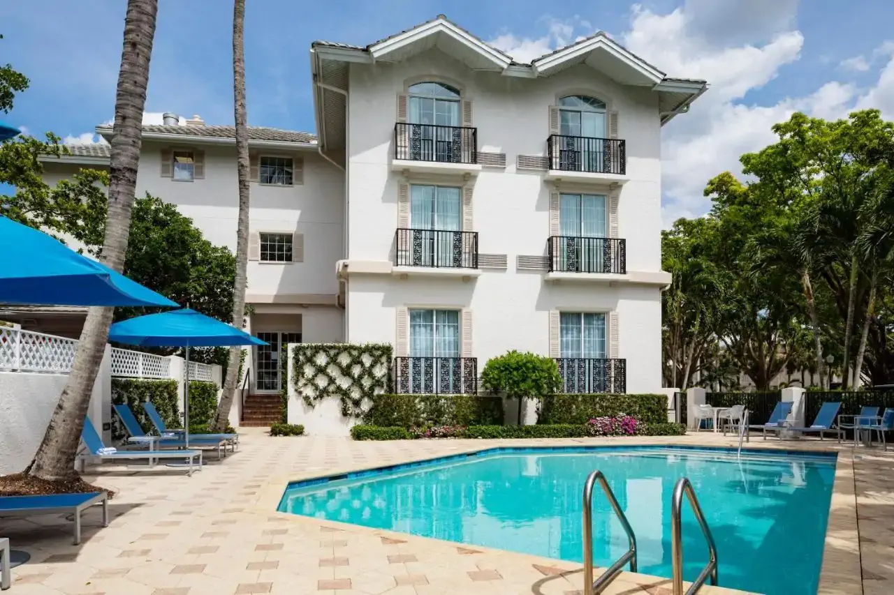 Exterior of a motel with pool on a sunny summer day