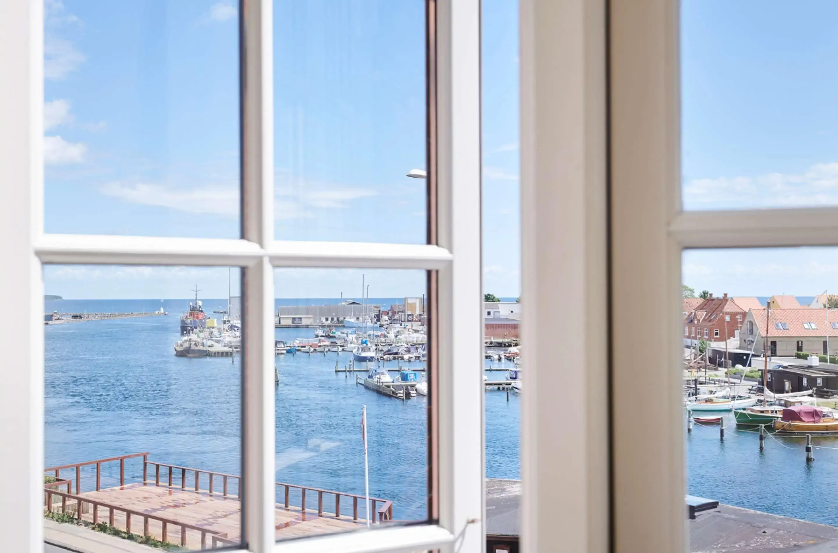 View of the sea through a white window