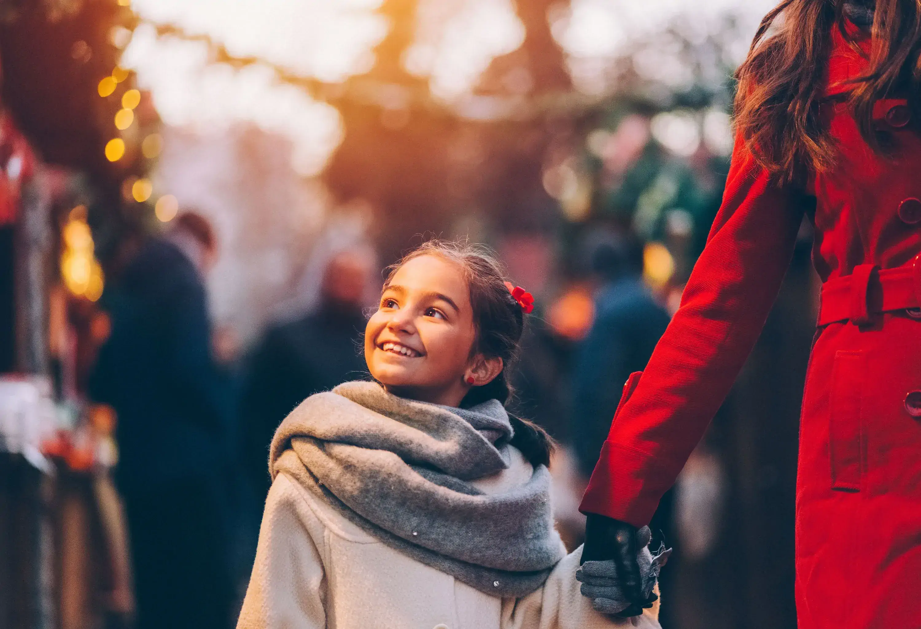 Mother and daughter enjoying a Christmas market