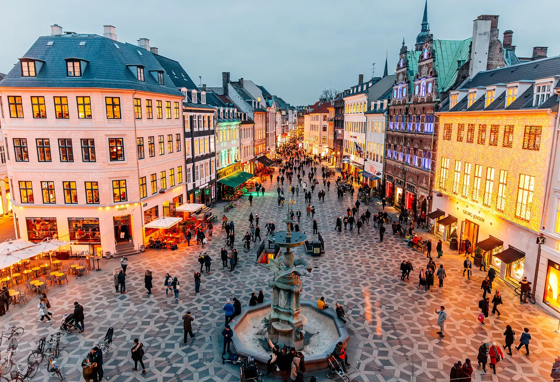 A city square and shopping district from above full of Christmas shoppers