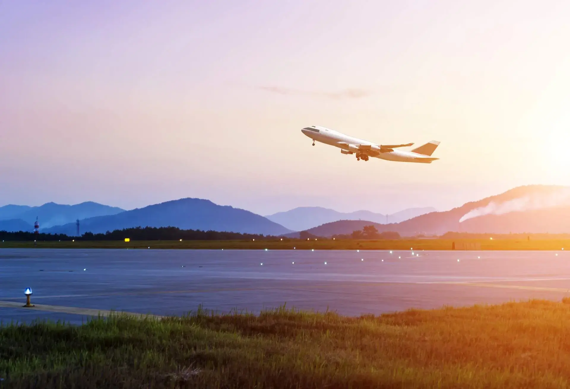 passenger plane fly up over take-off runway from airport at sunset; Shutterstock ID 157459556; Purpose: email; Brand (KAYAK, Momondo, Any): kayak